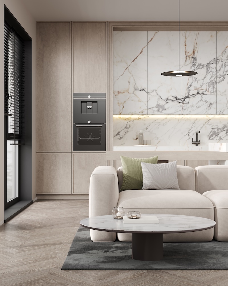 jasna sofa ustawiona tyłem do kuchni 